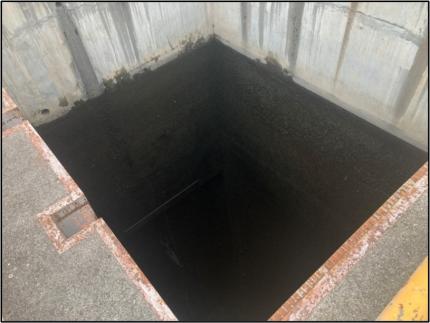 Concrete water chamber as the water level dropped.